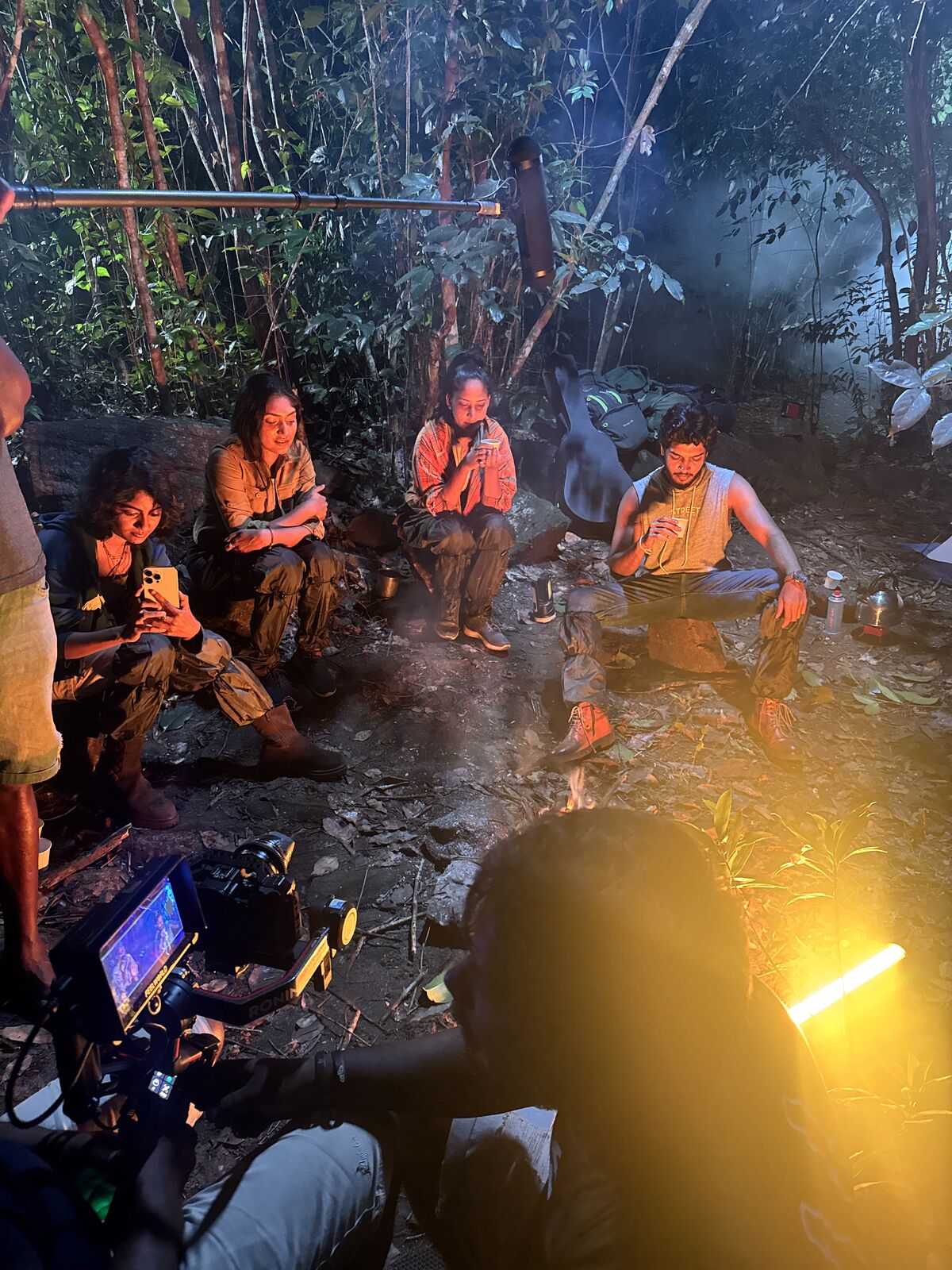 Camera operator framing a shot during a TVC shoot